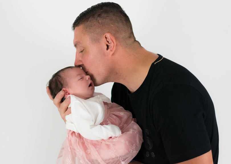 Alan Barefoot pictured with his newborn daughter
