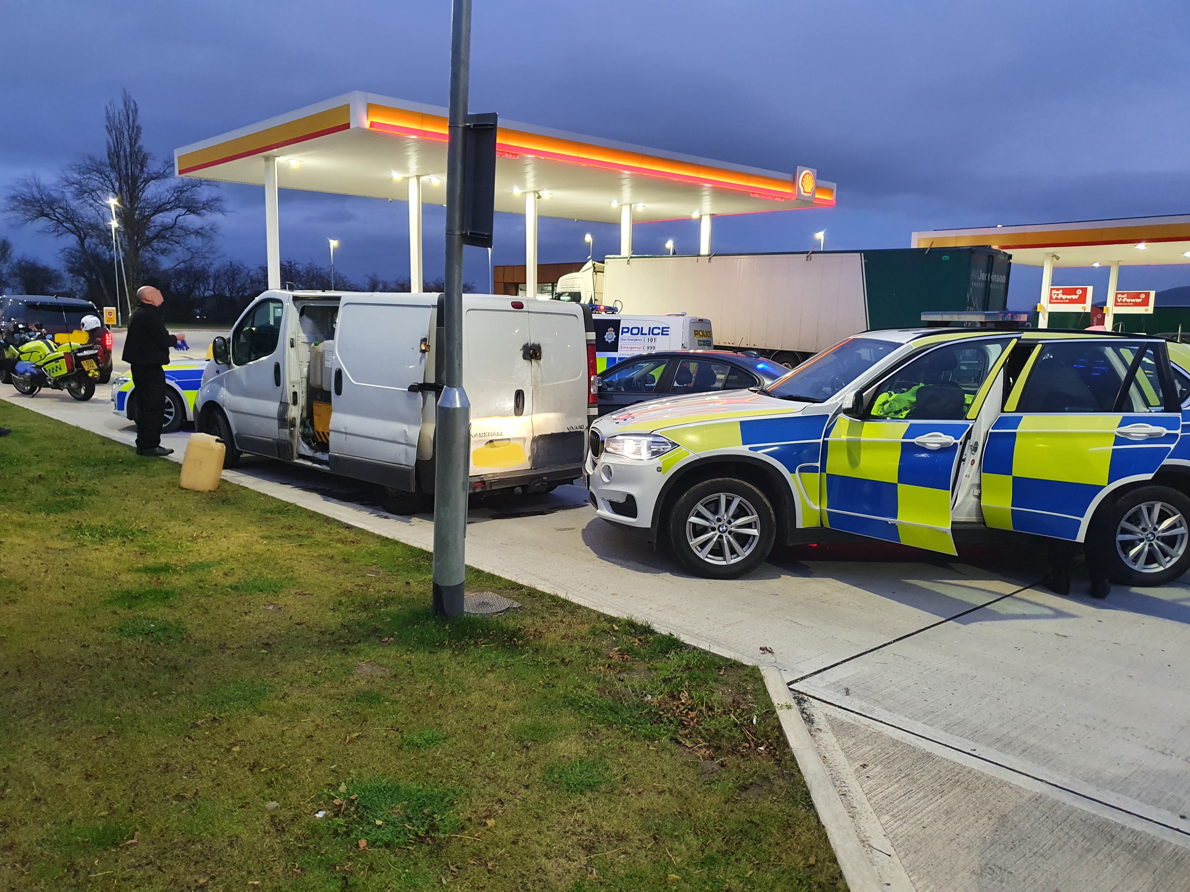 Police vehicles box suspect vehicle in