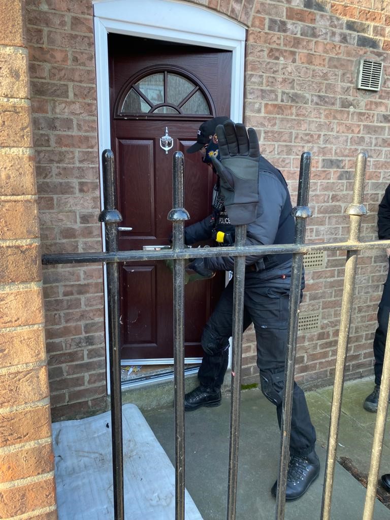 Image of drugs warrant taking place
