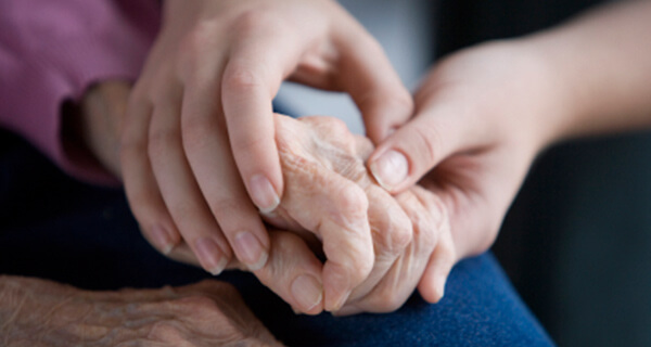 comforting elderly person