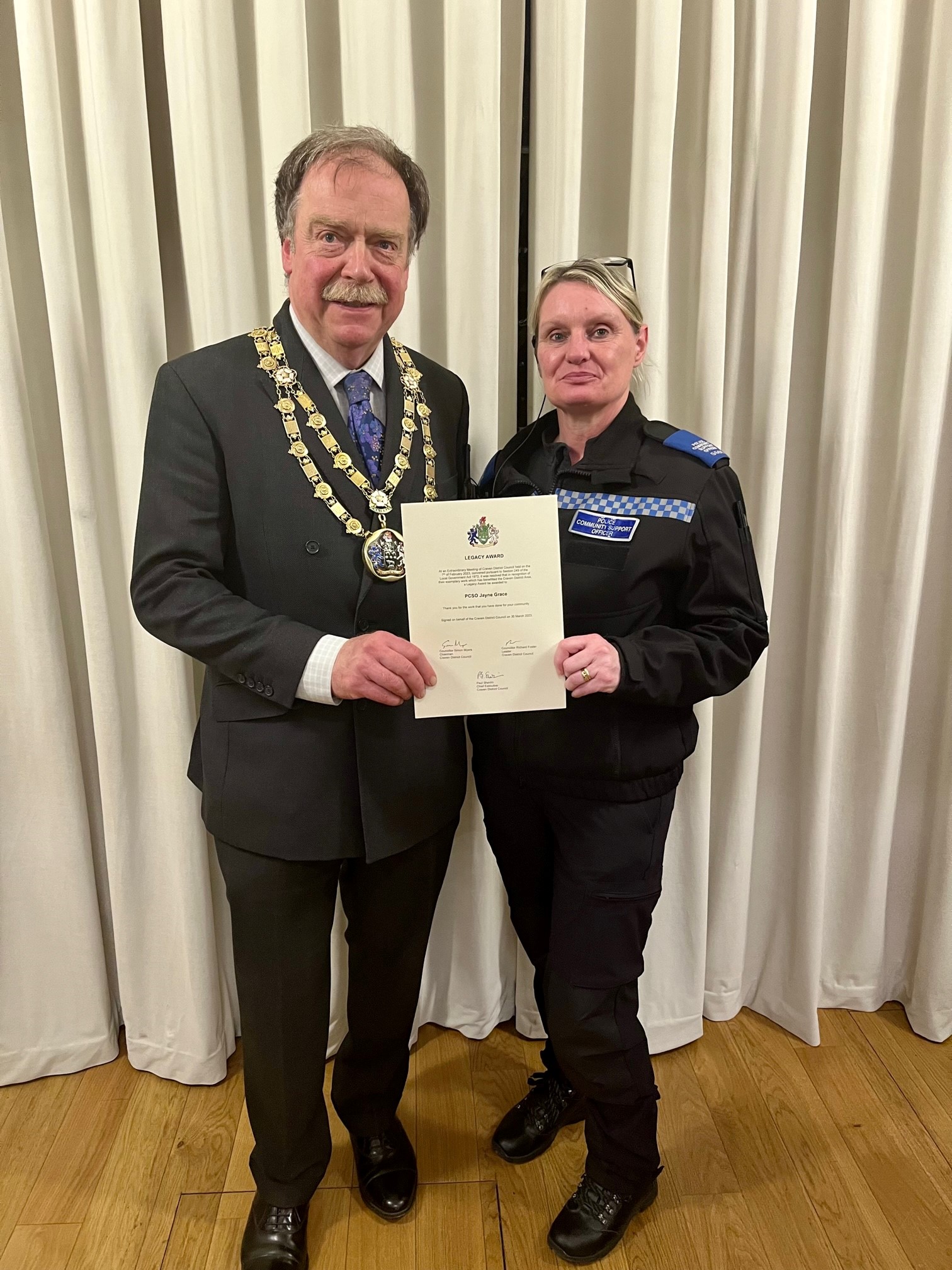 Jayne is pictured receiving the award from The Chairman of Craven District Council, Simon Myers