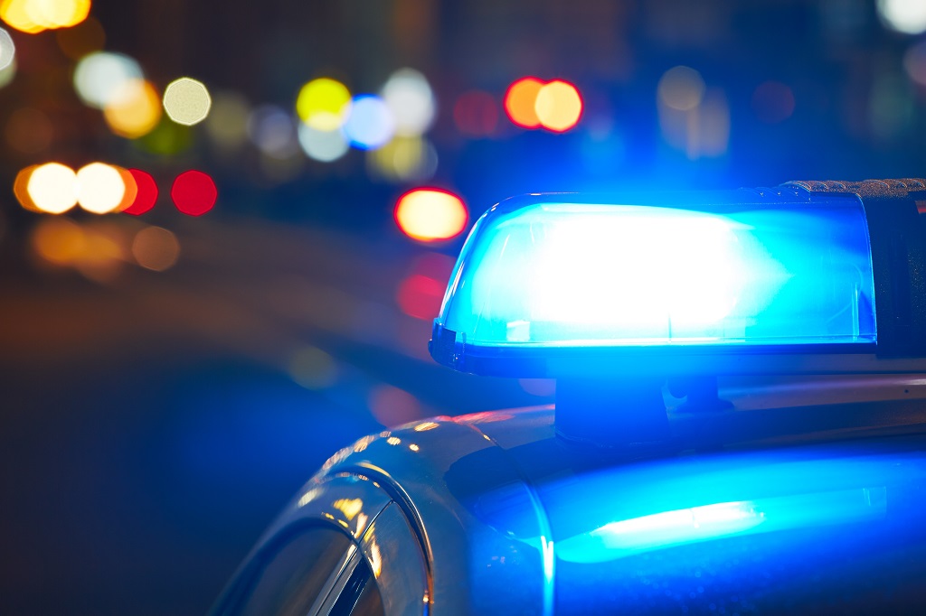 police car with blue light at night