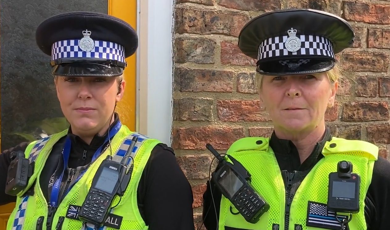 a PCSO and a PC in their reflective union and police hats
