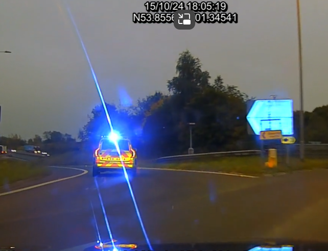 police car on blue lights 