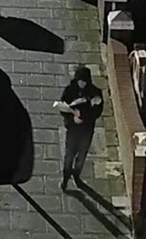 Nicholas Polihronos captured on CCTV making off with items from the flat burglary.jpg