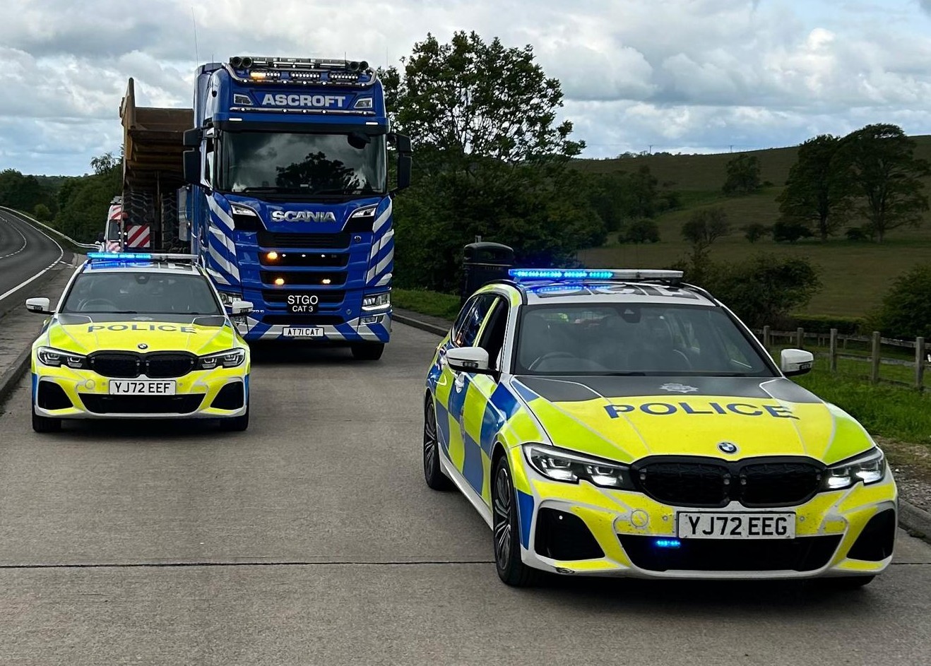 abnormal load with police cars