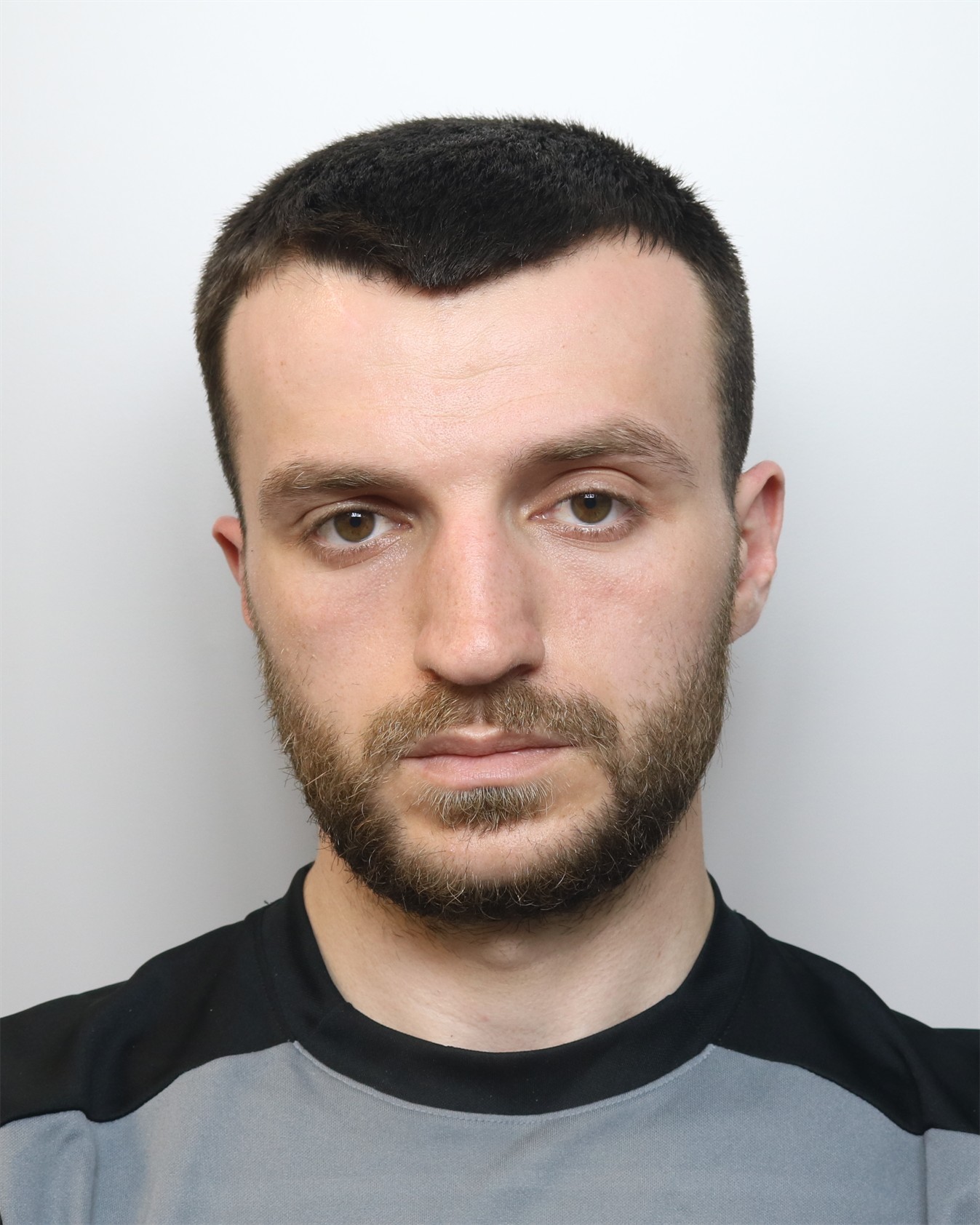 custody pic of Florian Gjuni