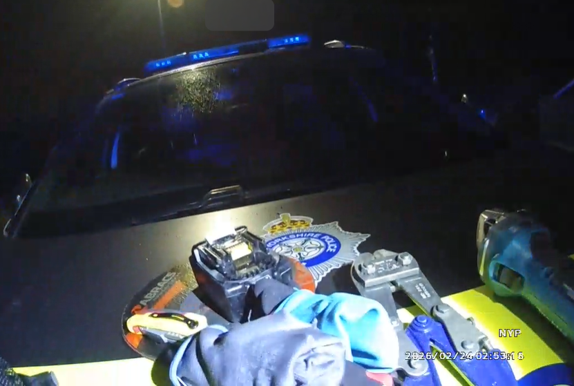 tools on bonnet of marked police car 
